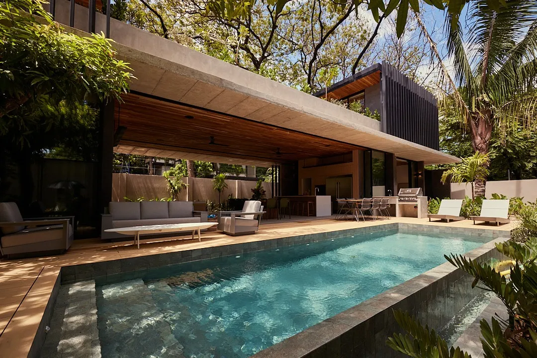 Calma House villa heated pool with shaded patio and lounge furniture, North Playa Guiones, Nosara, Costa Rica