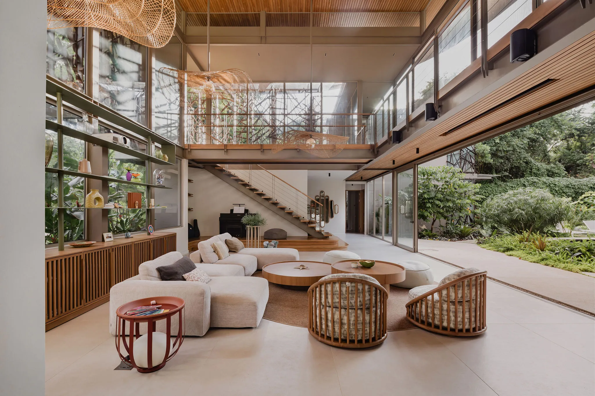 SEN villa double-height living room with sunken sofa and floor-to-ceiling jungle views, Nosara contemporary design