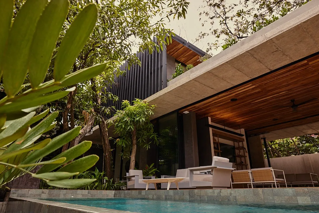 Calma House villa pool corner with tropical landscaping, North Guiones Nosara