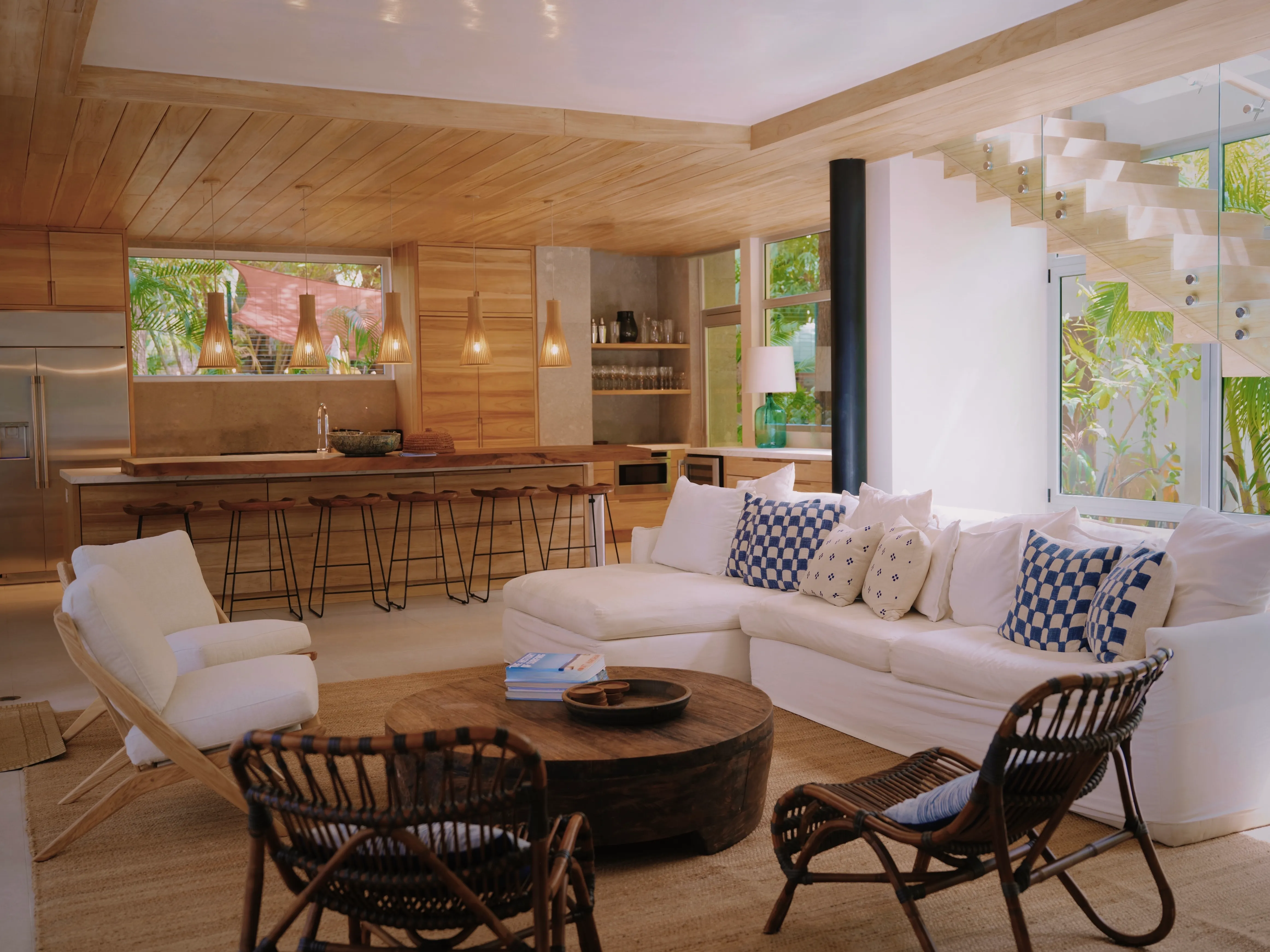 Tres Hermanas villa living room with white sofas and round coffee table, Nosara