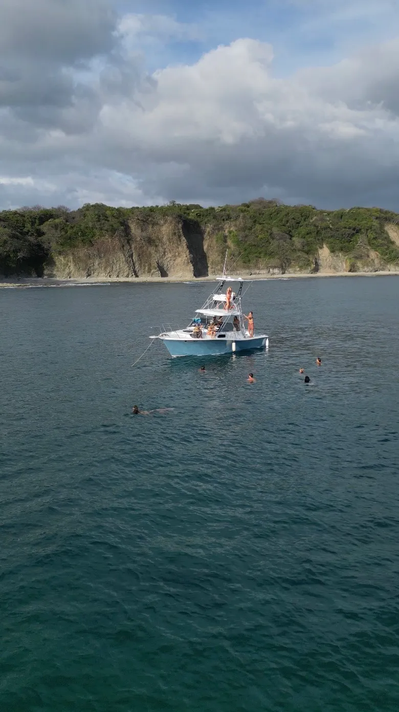 Group of friends on a private sportfishing boat off the Nosara coast, Costa Rica